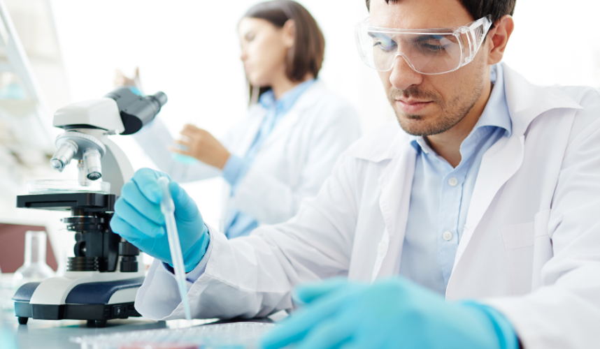 Veterinarian examining samples in a laboratory, showcasing advanced research techniques in animal care and health.